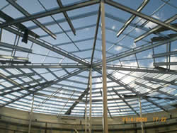 Metal roof with gutters and downpipes on a Perth building